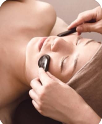 Hot stone facial massage at Liya Pure Beauty & Spa